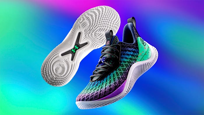 View of black and purple Curry shoes.